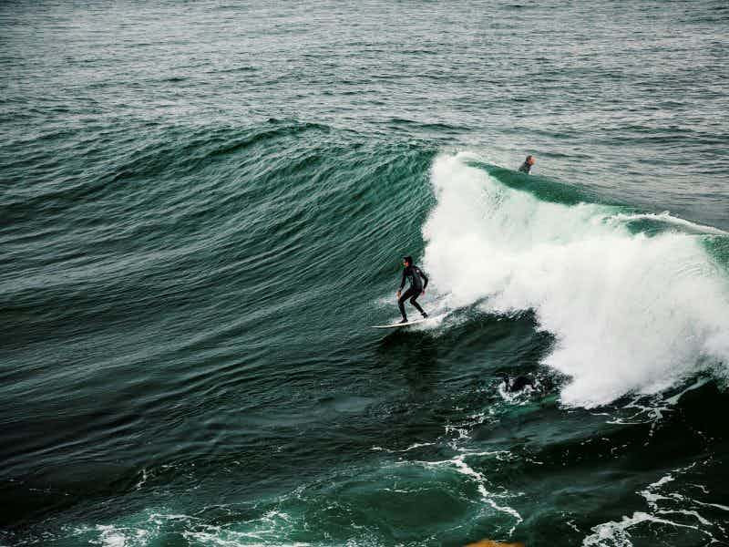 surfer catching a good wave in santa cruz