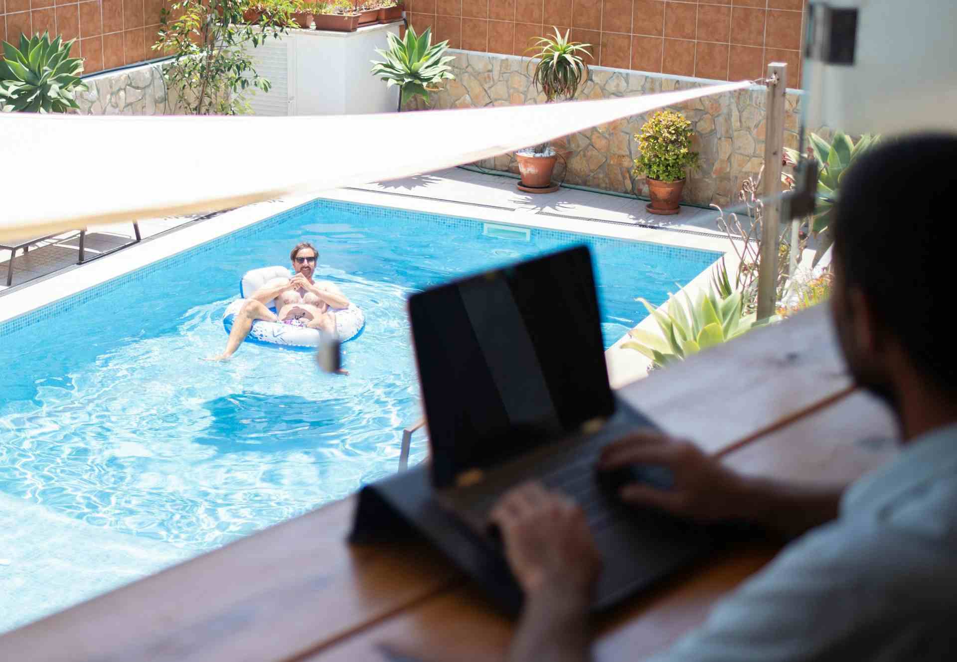 digital nomad in the pool