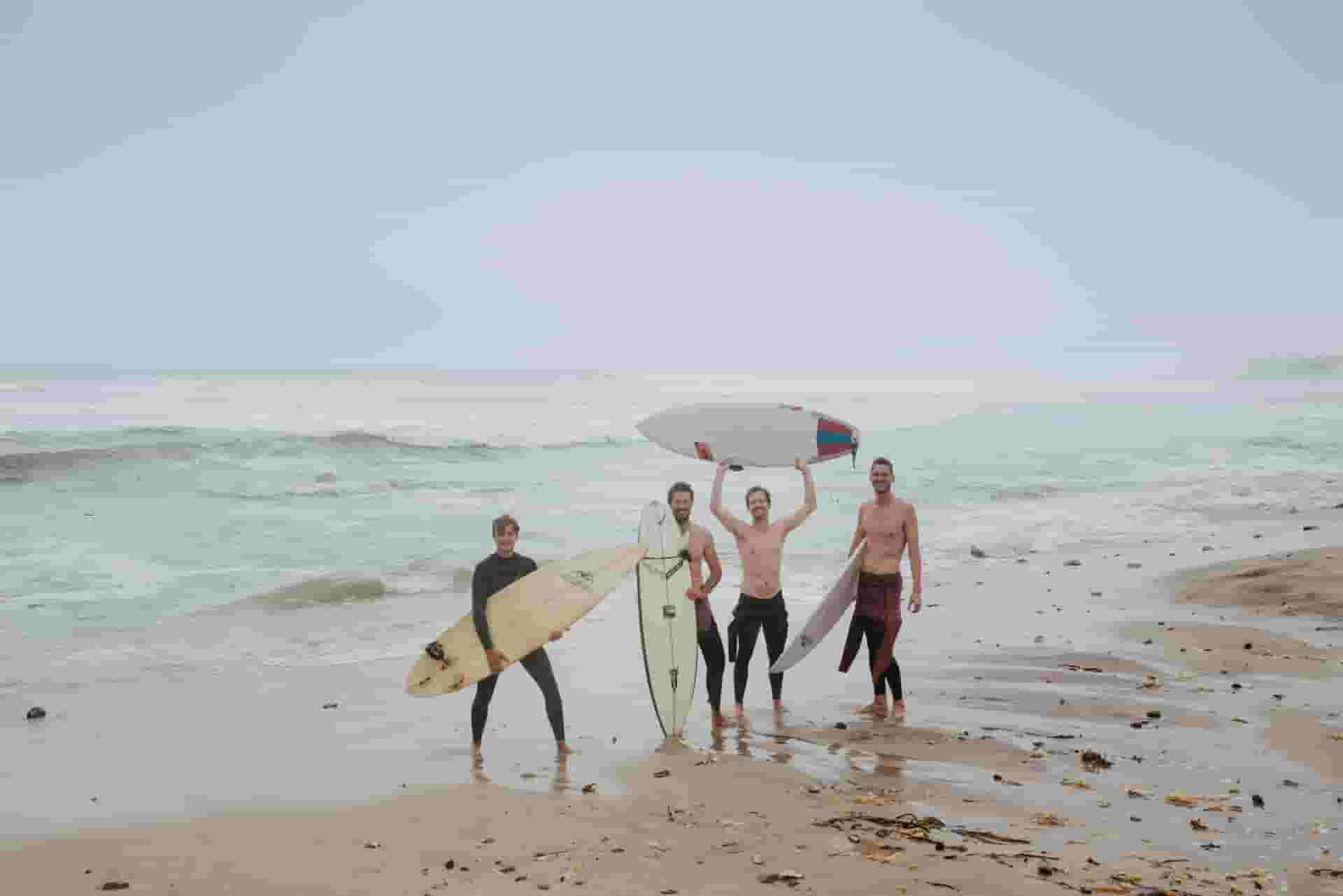 surfers on beach