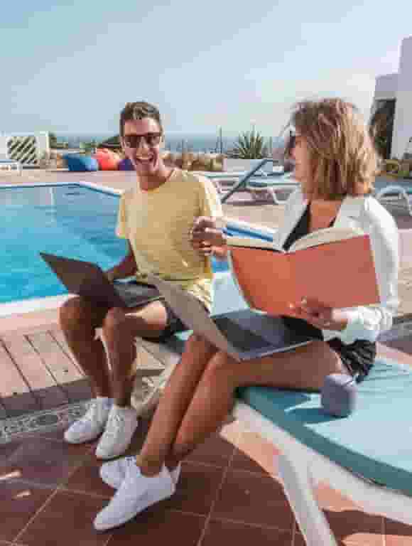 digital nomads working from the pool