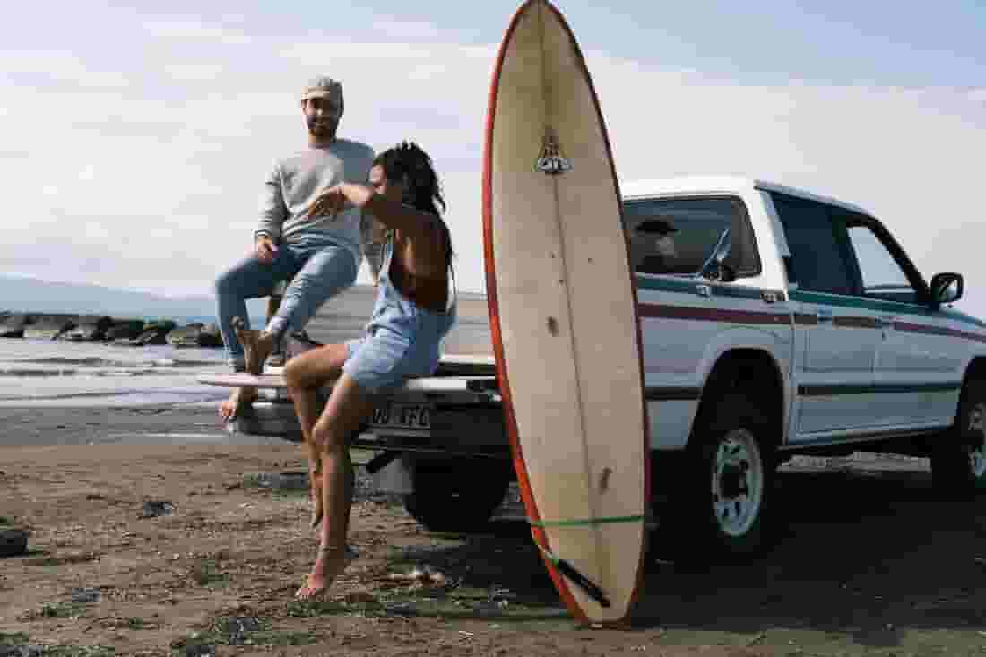 surfers chillin on the beach