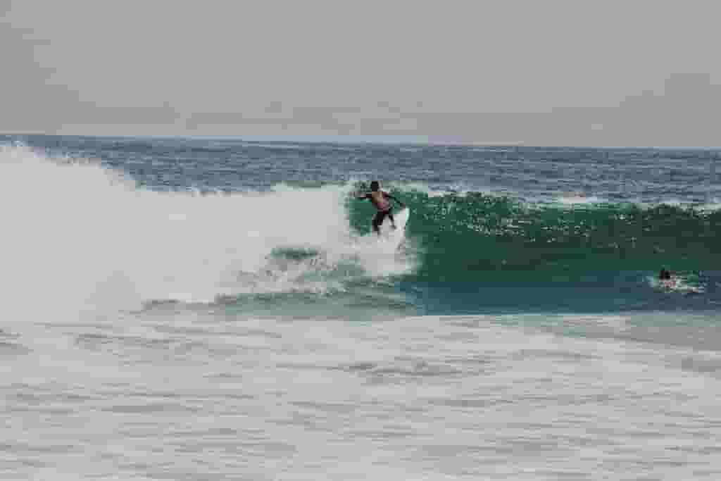 surfer ripping the wave