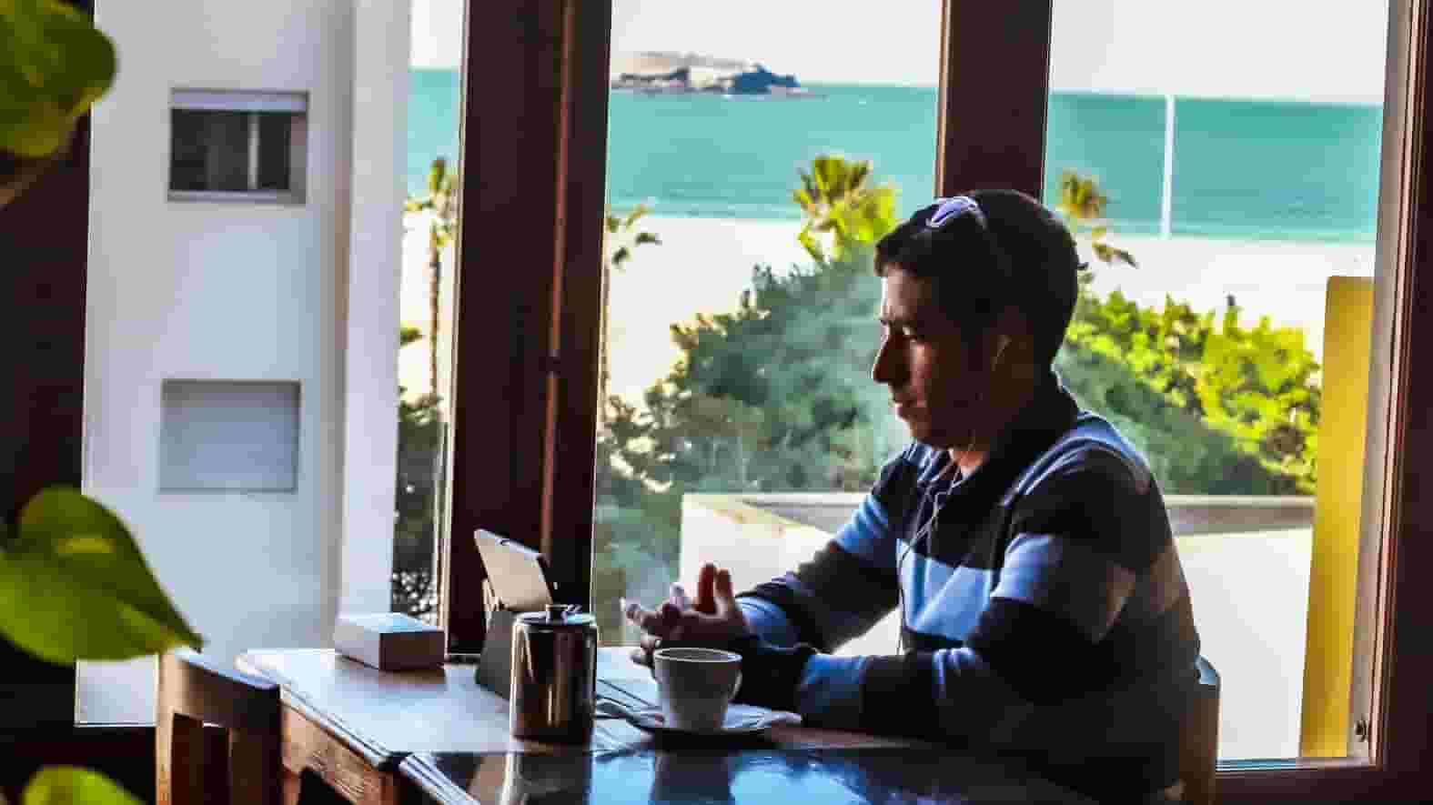 working and drinking coffee
