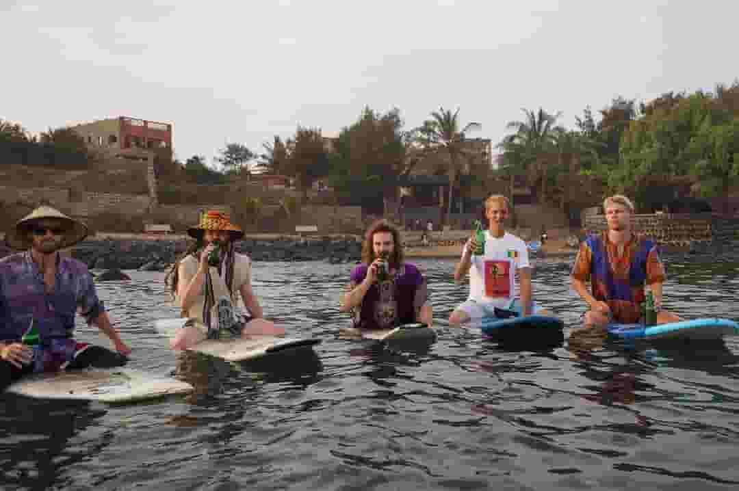 surfers drinking beers