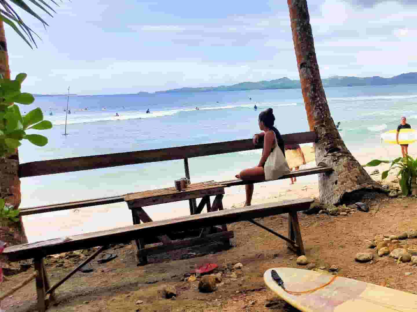 watching surfers from the beach