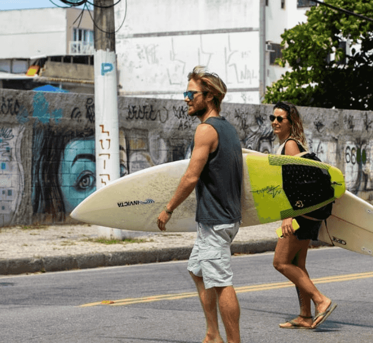 surfer heading to the beach