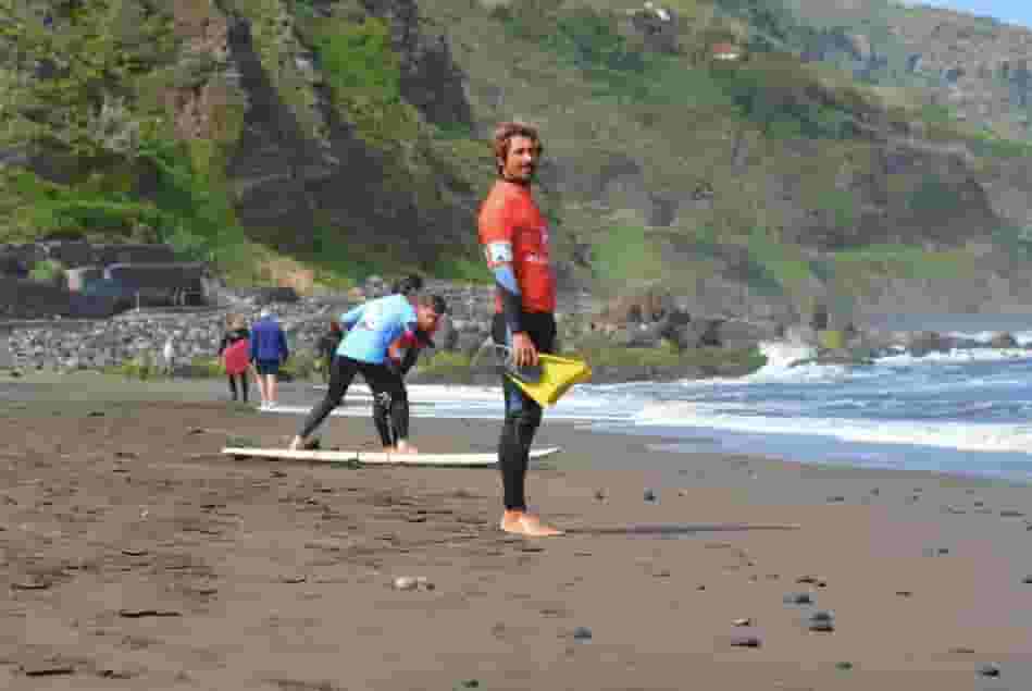 surfers on the beach