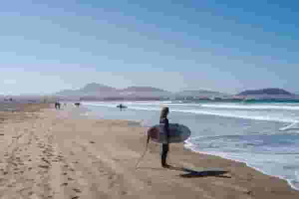 surfer looking at waves