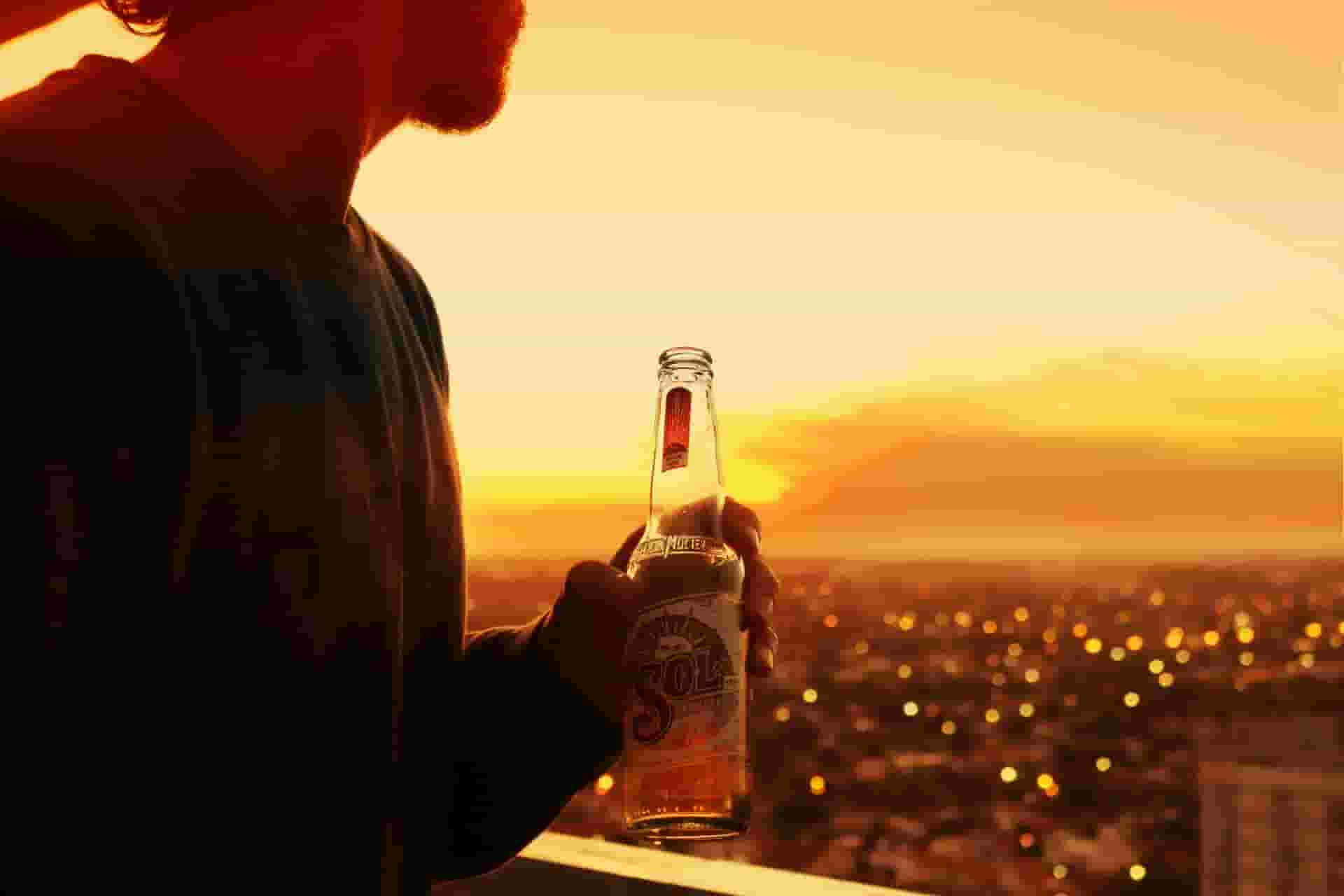 remote worker with a beer