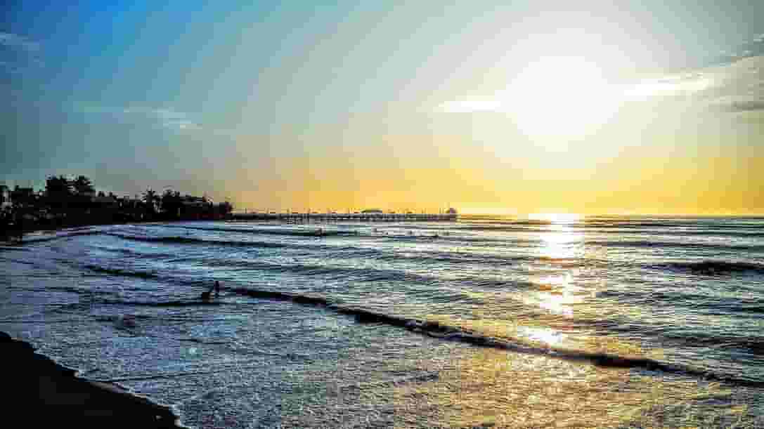 surfers in the water in Huanchaco