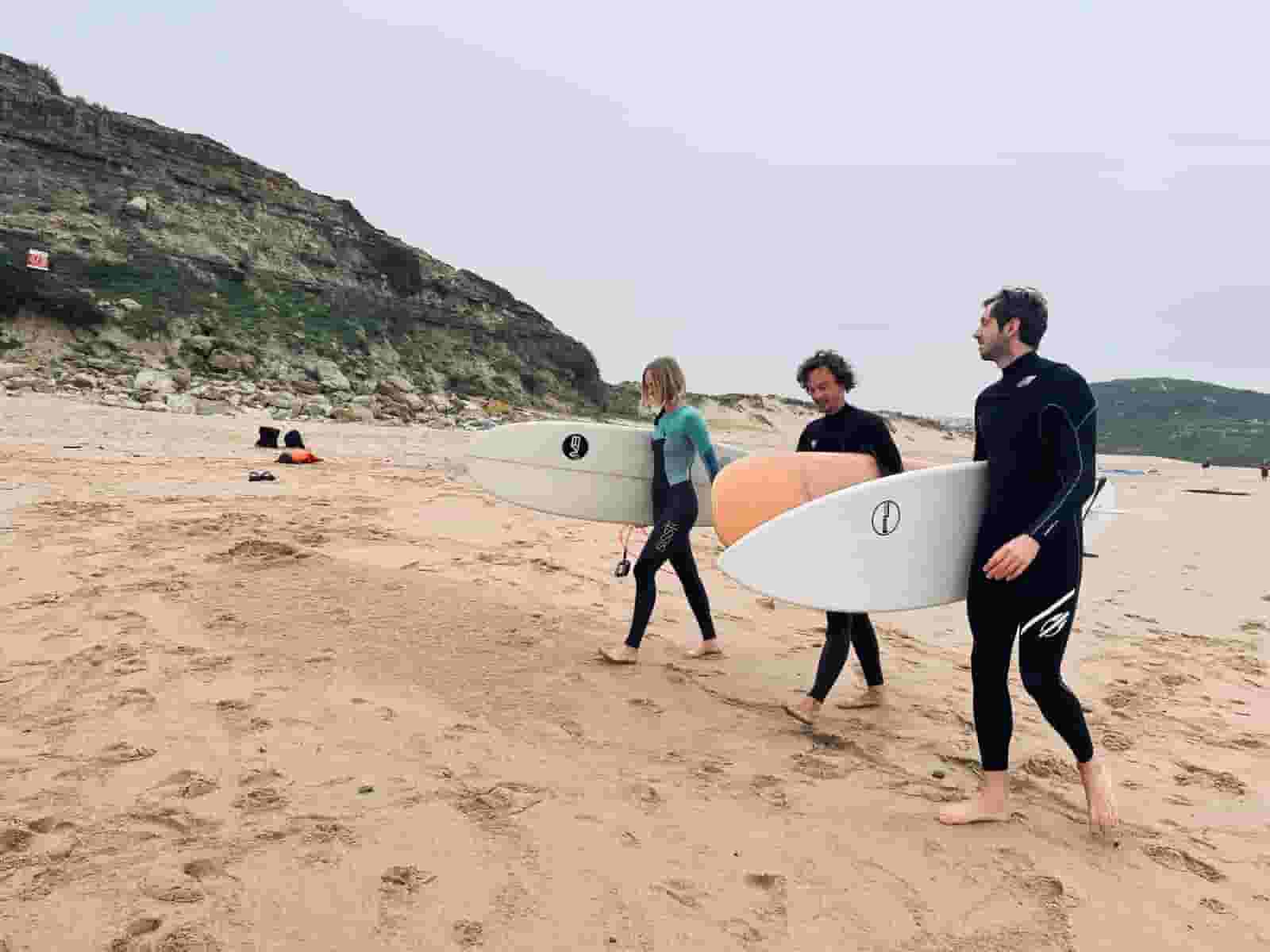 surfers on the beach