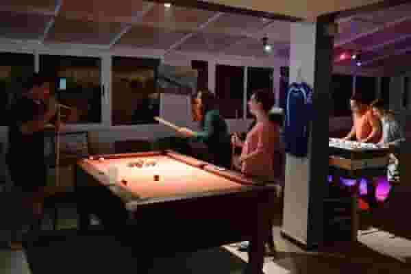remote workers playing pool