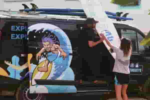 loading surfboards on truck