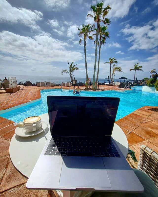 laptop by the pool
