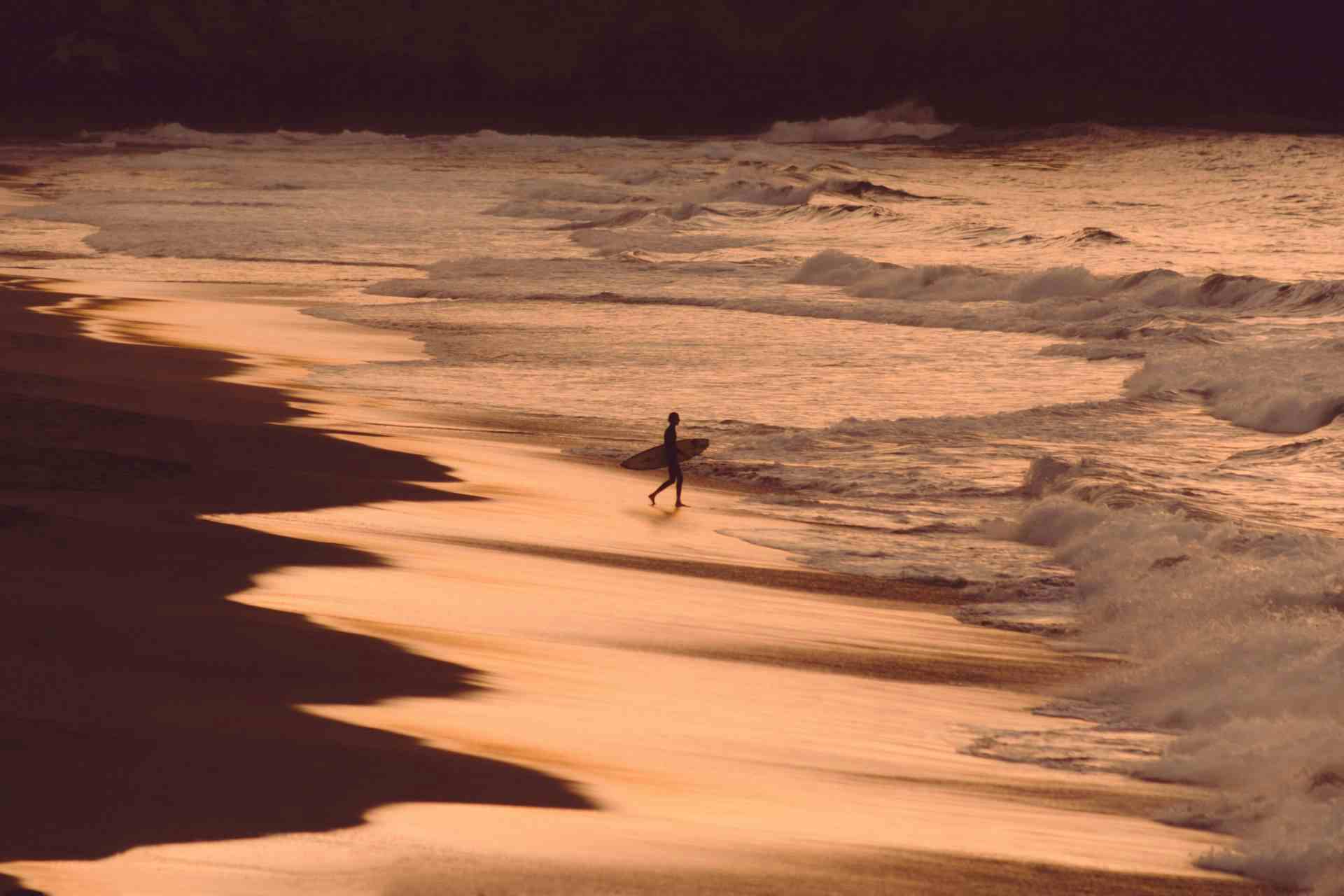 lonely surfer on beach