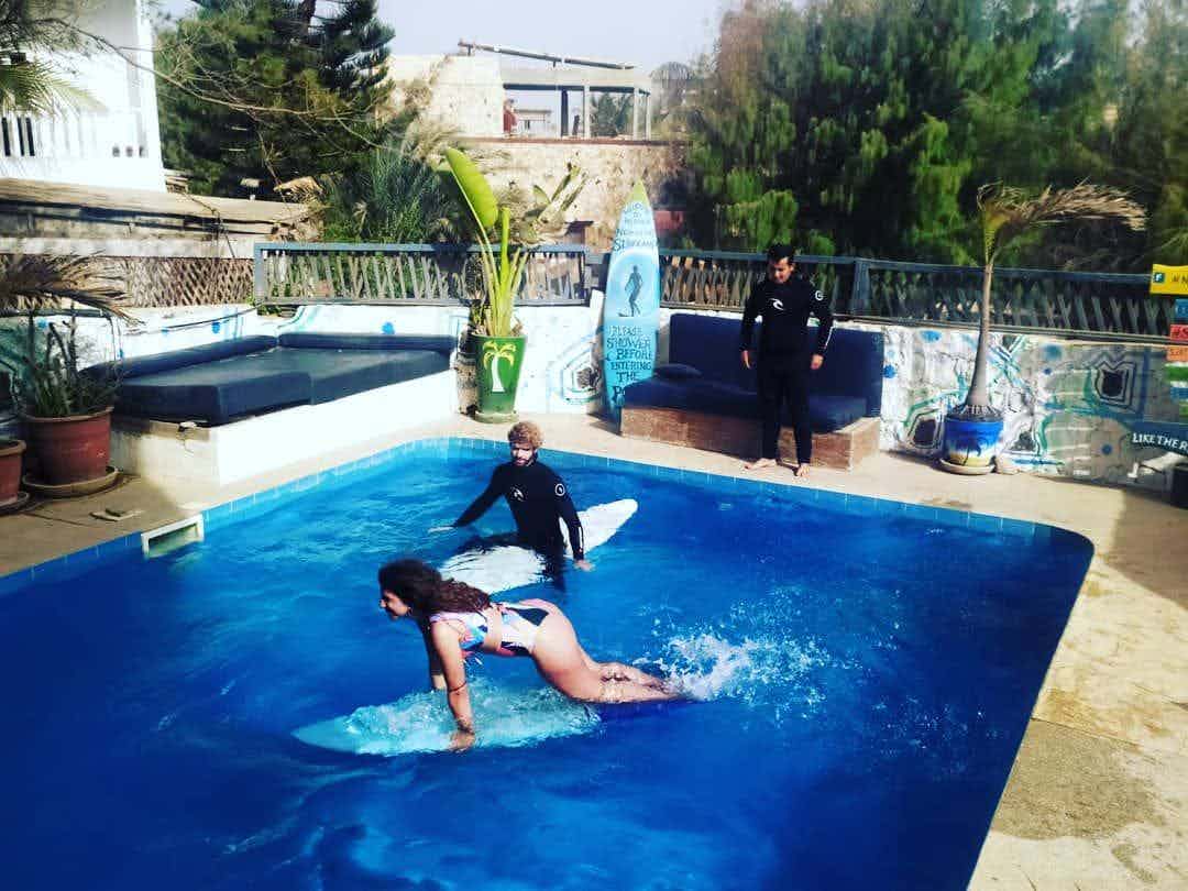 remote workers practicing surf in pool