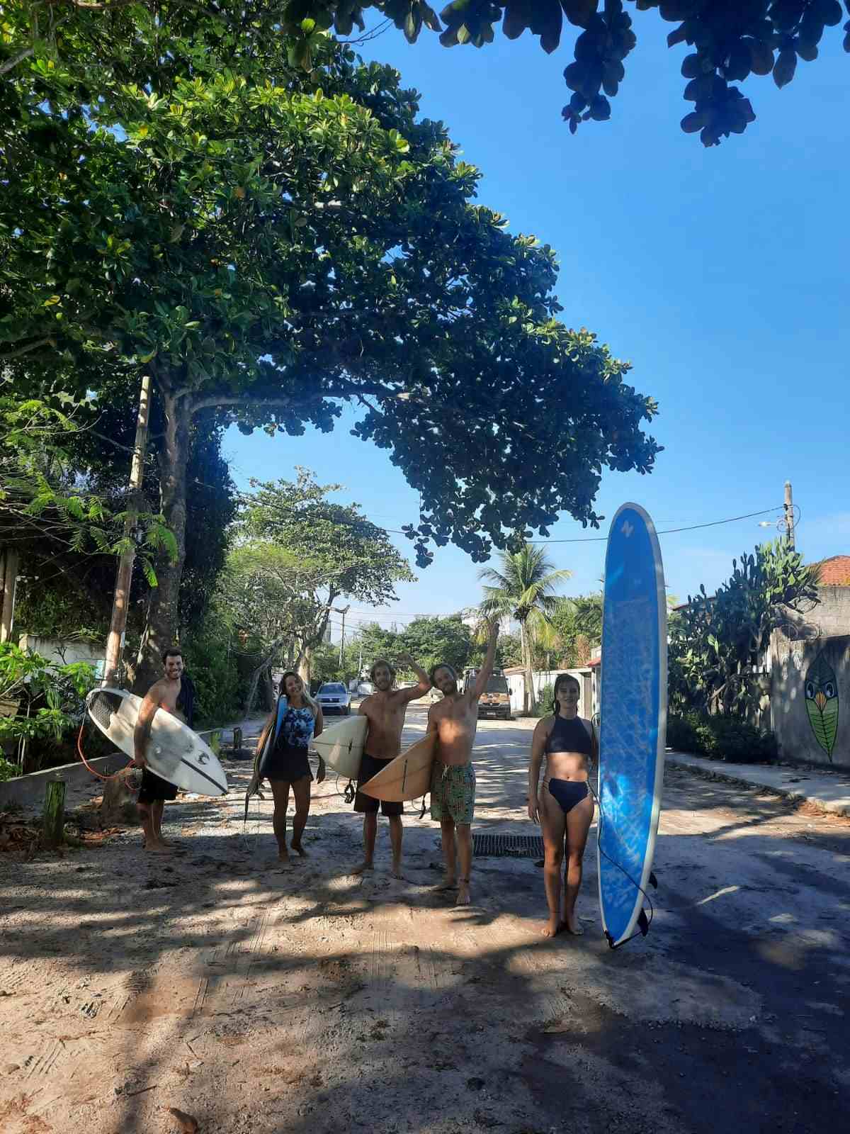 surfers heading to the beach