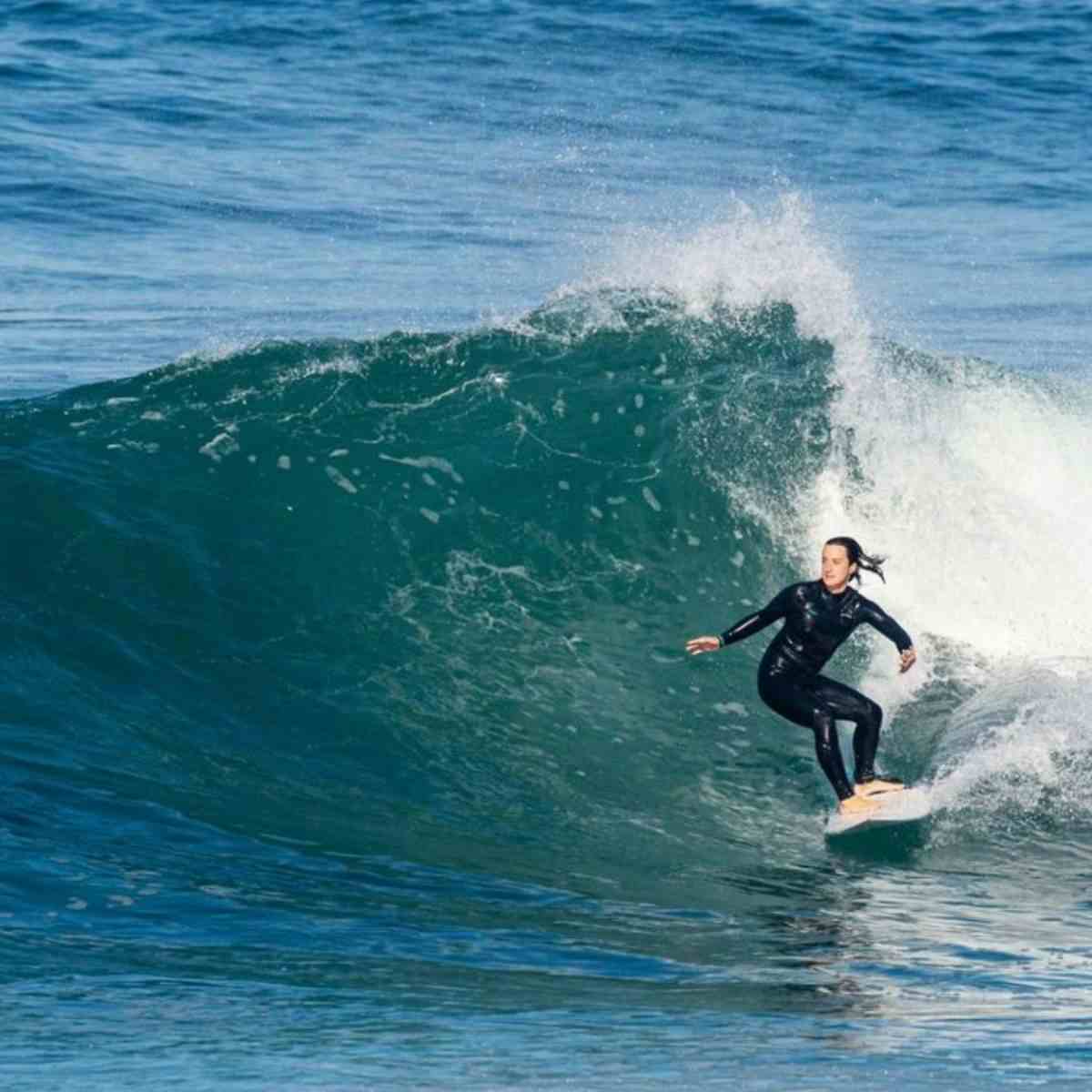 Woman surfing in portugal