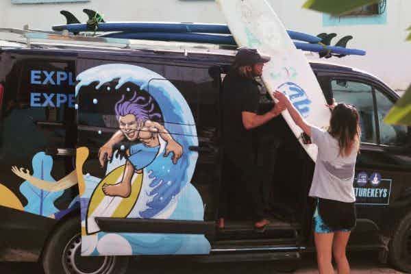 loading surfboards on truck